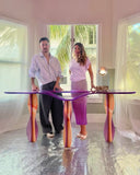 Contemporary designer console showcasing fluid glass craftsmanship. Crafted as a focal point for sophisticated spaces.