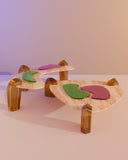 Sculptural low table featuring a handcrafted stone and resin surface. A designer coffee table inspired by island landscapes.