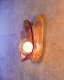 Luxury wall light with artistic glass detailing and a sculptural silhouette. Designed to bring warmth and character to contemporary interiors.