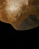 Detail of the textured handcrafted resin surface on the Aurisino sculptural coffee table by Alex Turco