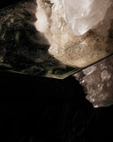 Detail of the Cristallo coffee table highlighting the connection between the natural quartz crystal and glass top