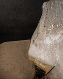 Close-up of the natural quartz crystal structure supporting the Ialino coffee table
