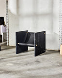 Luxury marble chair featuring a geometric architectural silhouette. Designed as a statement piece for contemporary interiors.