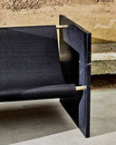 Sculptural Nero Marquina chair featuring refined geometric forms. Crafted as a statement furniture piece for modern interiors.