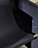 Contemporary marble chair highlighting natural veining and texture. Designed for luxury living environments