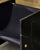 Designer stone chair crafted from premium Nero Marquina marble. A collectible seating piece with architectural appeal.