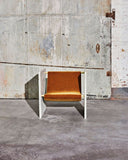 Sculptural stone chair crafted from Pistache marble. A designer chair featuring distinctive natural stone patterning.