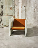 Luxury marble chair with a monolithic sculptural silhouette. Designed as a statement seating piece for modern interiors.