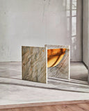 Sculptural stone chair featuring bold geometric detailing. Crafted as a functional work of art.