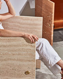 Luxury stone chair featuring a monolithic architectural silhouette. Designed as a statement piece for contemporary interiors.
