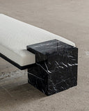 Luxury marble bench featuring a monolithic architectural silhouette. Designed as a statement seating piece for sophisticated interiors.