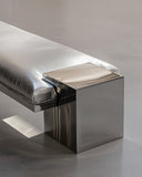 Luxury stainless steel bench with a minimalist architectural profile. Designed as a statement piece for contemporary interiors.