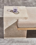 Designer travertine bench with sculptural geometric detailing. Crafted to bring architectural character to luxury interiors.