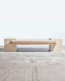 Sculptural travertine seating with a refined monolithic profile. A collectible design piece for contemporary interiors.