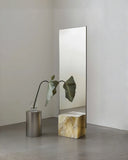 Luxury onyx mirror featuring a contemporary architectural silhouette. Designed as a statement piece for sophisticated interiors.