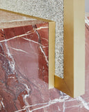 Contemporary mirror crafted with red jasper stone detailing. A collectible design piece with sculptural character.