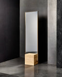 Sculptural wall mirror framed in natural travertine stone. A designer mirror inspired by contemporary architectural forms.