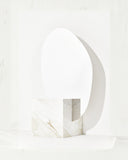 Sculptural floor mirror featuring a Calacatta marble frame. A designer mirror showcasing the beauty of natural stone and contemporary design.