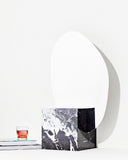 Luxury marble mirror featuring a contemporary sculptural profile. Designed as a statement piece for refined interiors.