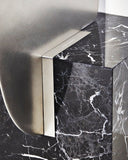 Designer marble mirror featuring dramatic black and white veining. Crafted as a statement piece for luxury spaces.