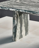 Luxury glass coffee table with an architectural sculptural profile. Designed for sophisticated living environments.