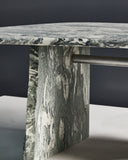 Sculptural centre table featuring a stone pedestal base and glass top. A collectible furniture piece for contemporary interiors.