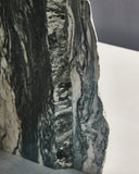 Glass coffee table with sculptural stone detailing throughout. Designed as a statement centrepiece for modern spaces.