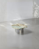 Luxury round coffee table combining stone and metal detailing. Designed to celebrate material craftsmanship.