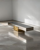 Sculptural X-or Bench featuring an intersecting geometric silhouette and contemporary architectural design. Luxury collectible bench for modern interiors.