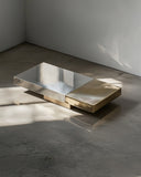 Contemporary stone coffee table with a geometric sculptural profile. Designed for luxury modern interiors.