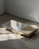 Luxury centre table with refined stone craftsmanship and metal accents. A statement furniture piece for contemporary homes.