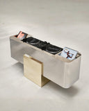 Sculptural storage console with a minimalist metal profile. Designed to elevate contemporary living spaces.