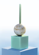 Candle on a sphere on a cube with a gradient background