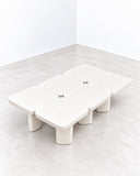 Alentes Atelier Leaf Table VI features a multi-section tabletop with softly rounded square forms and substantial cylindrical supports in a light ivory finish. Its expanded modular arrangement and minimalist sculptural design bring a distinctive contemporary presence to living spaces.