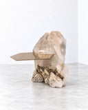 Alex Turco Ialino Side Table combining a sculptural, rugged stone-like base with an angular, warm-toned tabletop. Its contrast of raw organic texture and clean geometry makes it a distinctive accent for contemporary luxury interiors.