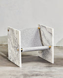 ADRI chair in Statuary featuring a sculptural stone frame with a textured light seat. A distinctive designer chair for luxury contemporary interiors.