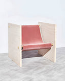 ADRI designer chair in Travertine featuring natural stone side panels and a warm upholstered seat. A sculptural seating piece for contemporary luxury interiors.