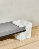 Arielle Assouline Coexist daybed featuring sculptural stone construction and refined upholstered seating. Designed to bring material contrast and contemporary character to luxury interiors.