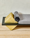 Coexist Statuary daybed combining architectural stone forms with a soft upholstered cushion. A sculptural designer lounge piece for sophisticated modern spaces.