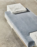 Arielle Assouline Coexist bench in Carrara marble showcasing refined sculptural proportions and natural stone character. Designed as a distinctive seating piece for sophisticated interiors.
