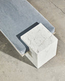 Arielle Assouline Coexist bench crafted in Carrara marble with a distinctive architectural silhouette. A luxury stone bench designed for sophisticated contemporary spaces.