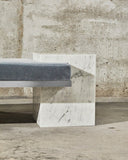 Coexist Carrara designer bench highlighting natural marble veining and sculptural construction. Crafted as a statement seating piece for refined interiors.
