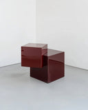 Coexist Askew designer side table featuring a sculptural geometric base and contemporary silhouette. A statement accent table for sophisticated luxury interiors.