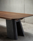 Designer dining table showcasing sculptural craftsmanship and elegant proportions. Crafted for sophisticated residential interiors.