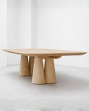 Sculptural dining table celebrating architectural design and premium craftsmanship. A collectible furniture piece for luxury homes.
