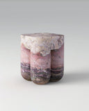 Luxury marble side table with a monolithic sculptural form. Designed as a statement piece for contemporary interiors.