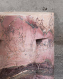 Designer marble accent table with a bold geometric silhouette. A collectible furniture piece for modern interiors.