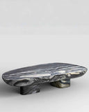 Marble-patterned stone table on a light gray background