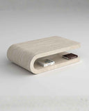 Modern stone coffee table with a shelf on a light gray background. FOLD | Marble Travertine Coffee Table | Limited Edition