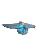 Sculptural glass coffee table with an organic floating form. Inspired by natural ice formations and contemporary design.